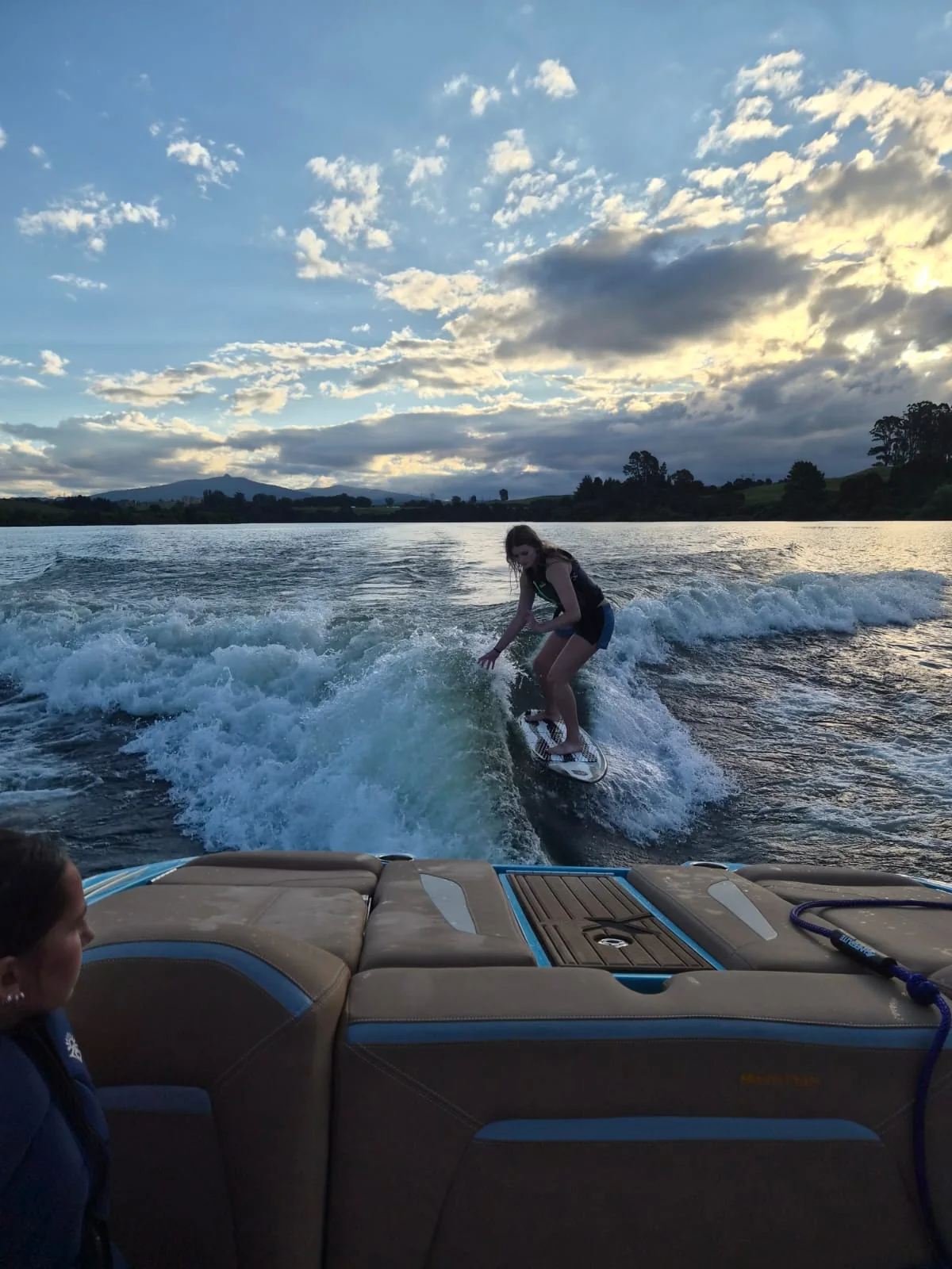 Wakesurf rider at sunset