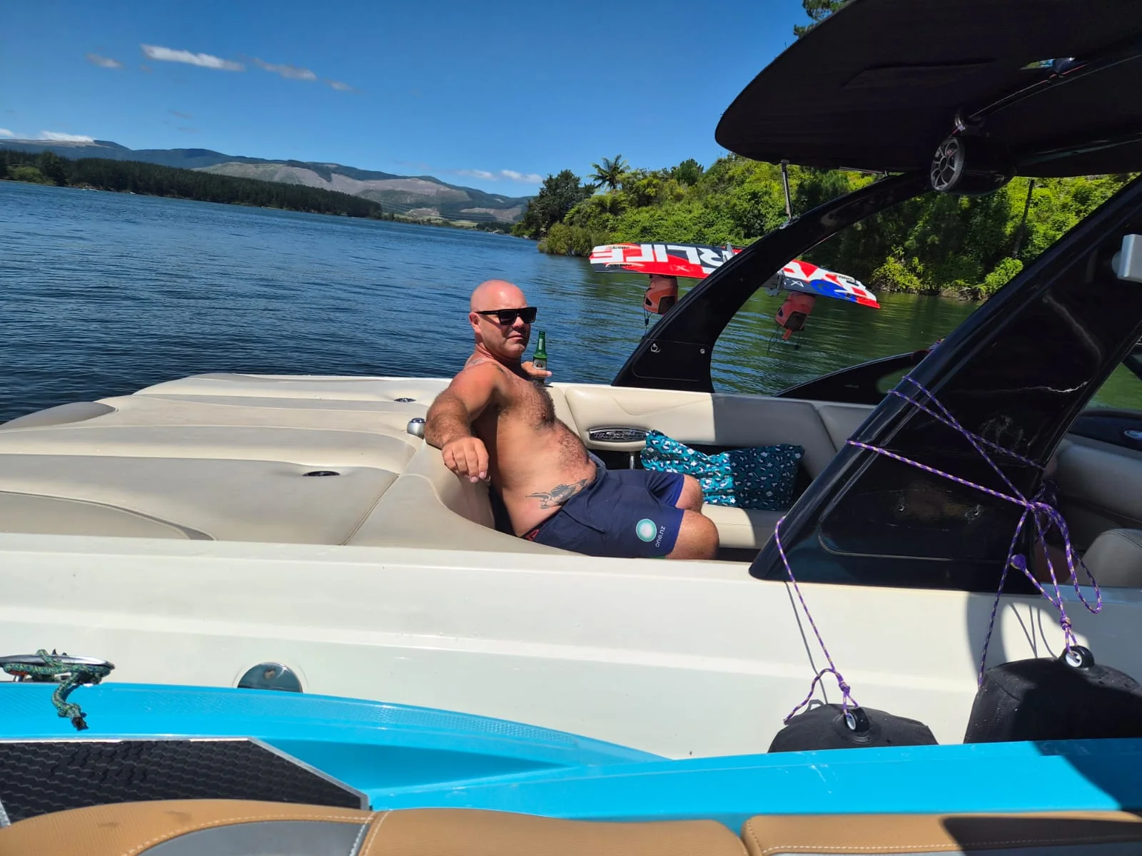 Guests relaxing aboard a private Lake Maraetai cruise